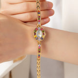 Klara® - Reloj dorado con cristales de colores