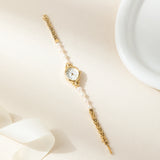 Ana® - Reloj dorado con pulsera de perlas