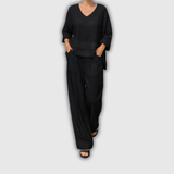 Paulina | Conjunto de lino negro con top asimétrico y pantalón palazzo