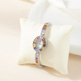 Klara® - Reloj dorado con cristales de colores