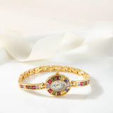 Klara® - Reloj dorado con cristales de colores