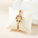 Klara® - Reloj dorado con cristales de colores