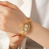 Helena® - Reloj dorado con esfera ovalada y marco negro