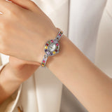 Klara® - Reloj dorado con cristales de colores