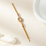 Klara® - Reloj dorado con cristales de colores