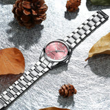 Nika® - Reloj plateado con esfera rosa